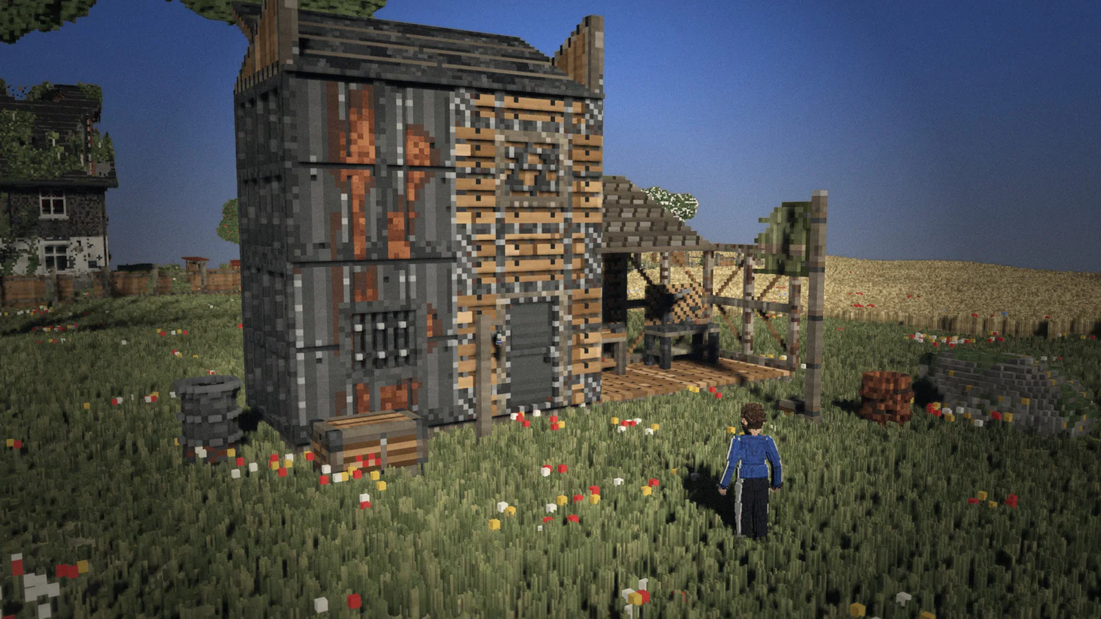 A self-built base at the edge of a village: walls in different construction grades, a workshop and a territory flag